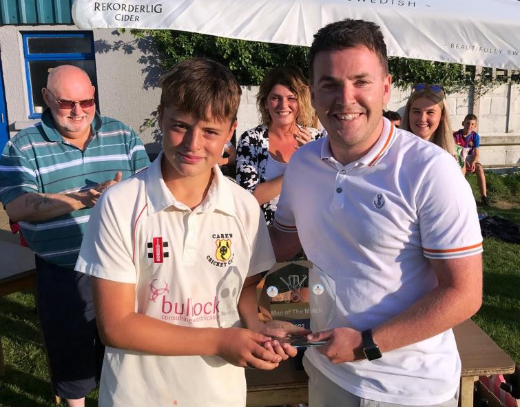 Man of the Match Logan Hall with adjudicator Craig Butland